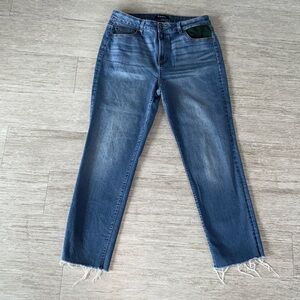 Medium wash jeans with one flannel accent pocket